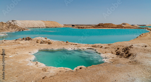 amazing view of the salt lakes in Siwa, Egypt. Beautiful colorful water surrounded by the desert
