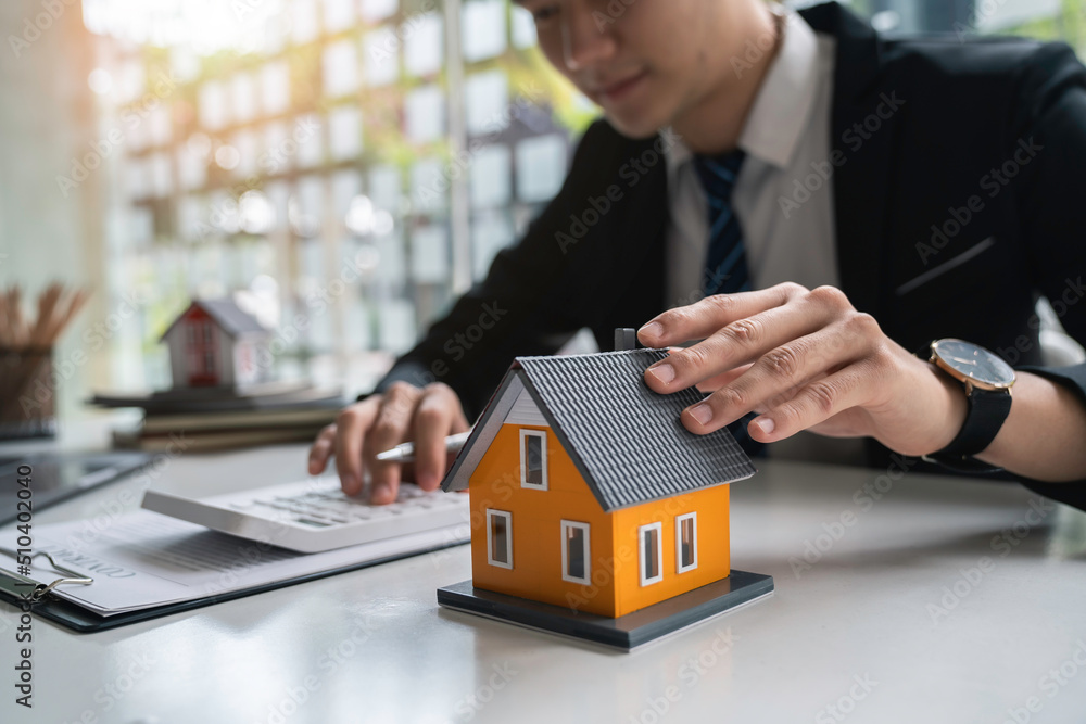Real estate agent or financial advisor consulting with client for investment. Insurance and real estate concept Real estate agent or financial advisor consulting with client for investment. Insurance and real estate concept