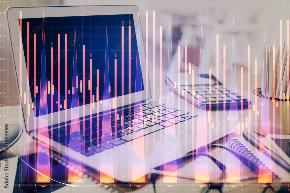 Forex market chart hologram and personal computer background. Multi exposure. Concept of investment. Forex market chart hologram and personal computer background. Multi exposure. Concept of investment.