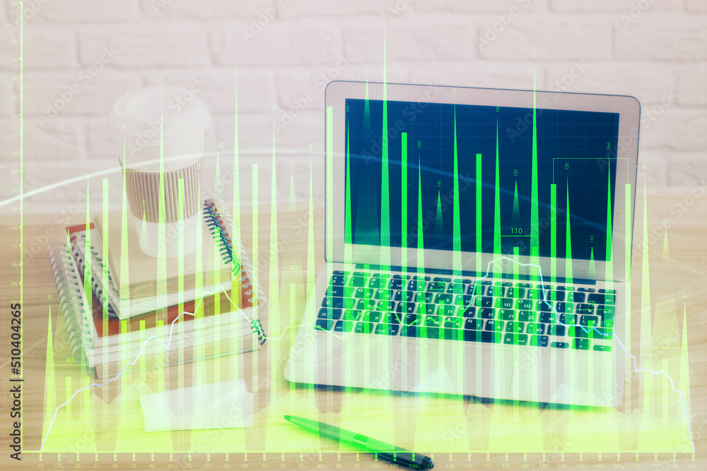 Forex market chart hologram and personal computer background. Multi exposure. Concept of investment. Forex market chart hologram and personal computer background. Multi exposure. Concept of investment.