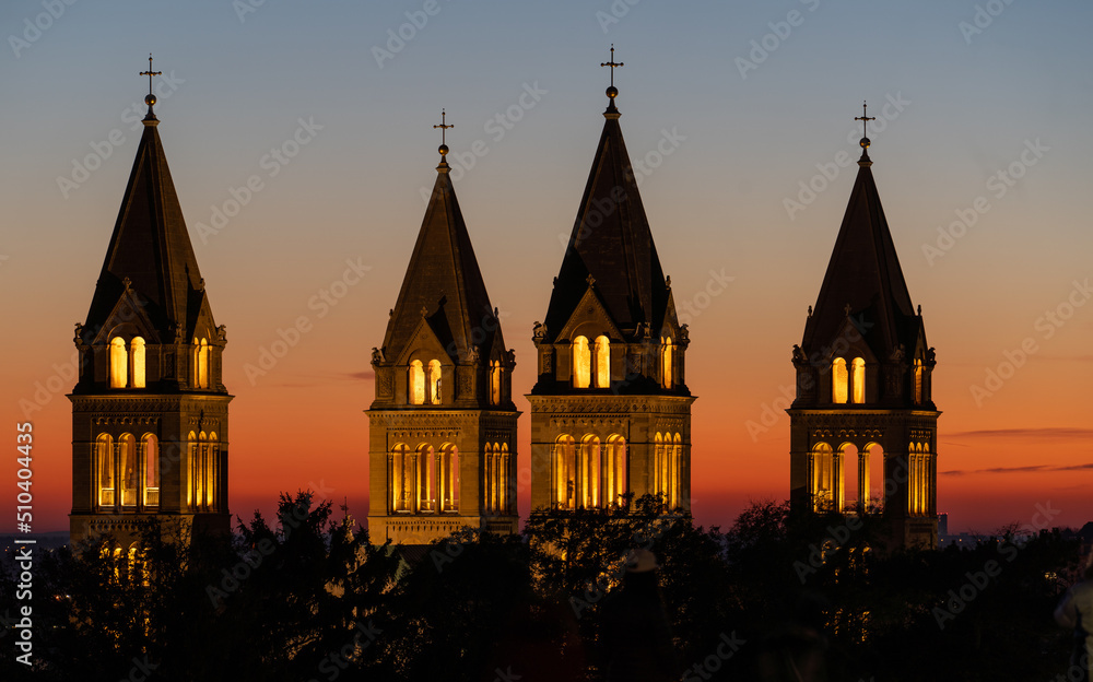 Fototapeta premium Detail of cathedral towers with sunrise