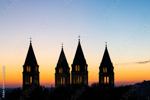 Detail of cathedral towers with sunrise photo