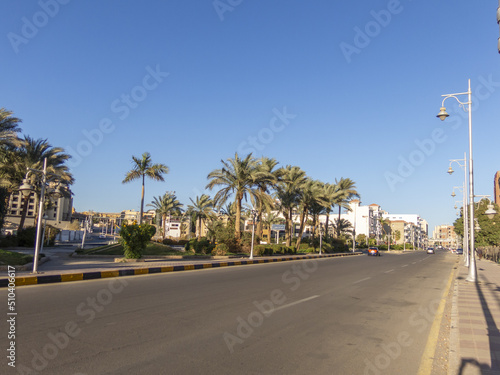 Empty Mamsha, sunny morning, palm trees, road. Egypt, Hurghada