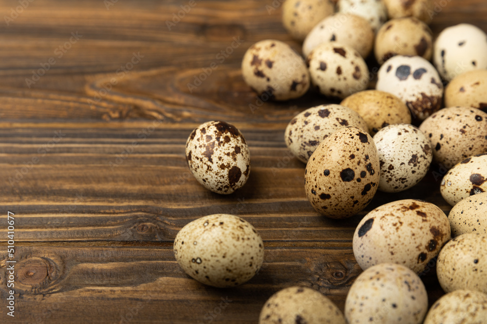 Quail eggs on a brown texture background.Organic food. Place for text. Fresh quail eggs. Quail eggs on a brown texture background.Organic food. Place for text. Fresh quail eggs.