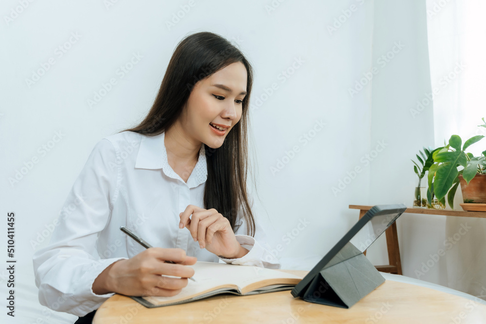 business woman in white shirt working and calculating about finance with document report and digital mobile tablet on desk at home office, digital online marketing and financial business concept business woman in white shirt working and calculating about finance with document report and digital mobile tablet on desk at home office, digital online marketing and financial business concept