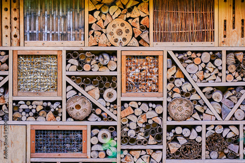 View to an insect hotel made of different materials to offer a retreat for many species.