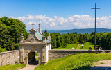 Swiety Krzyz, Poland - June 5, 2022: Lysa Gora, Swiety Krzyz mount hilltop with gate to medieval Benedictive Abbey and sanctuary in Swietokrzyskie Mountains near Nowa Slupia village in Poland