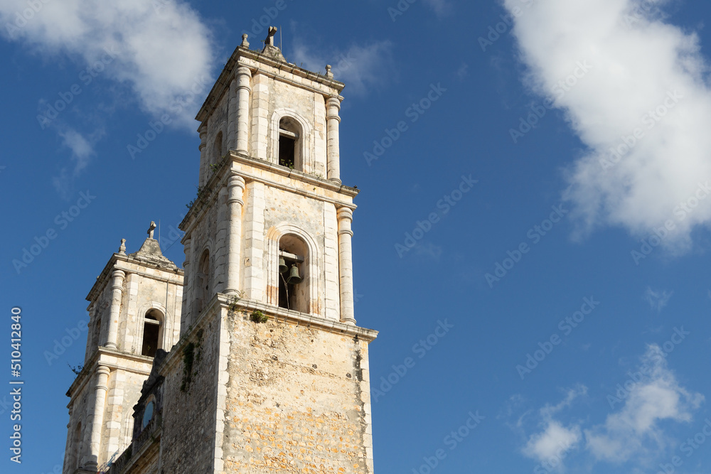 Bell towers of the old catholic cathedral against the sky. Colonial Catholic Church, Mexico.