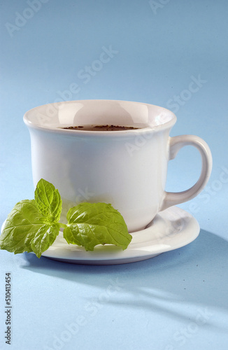 hot tea with mint on a blue background