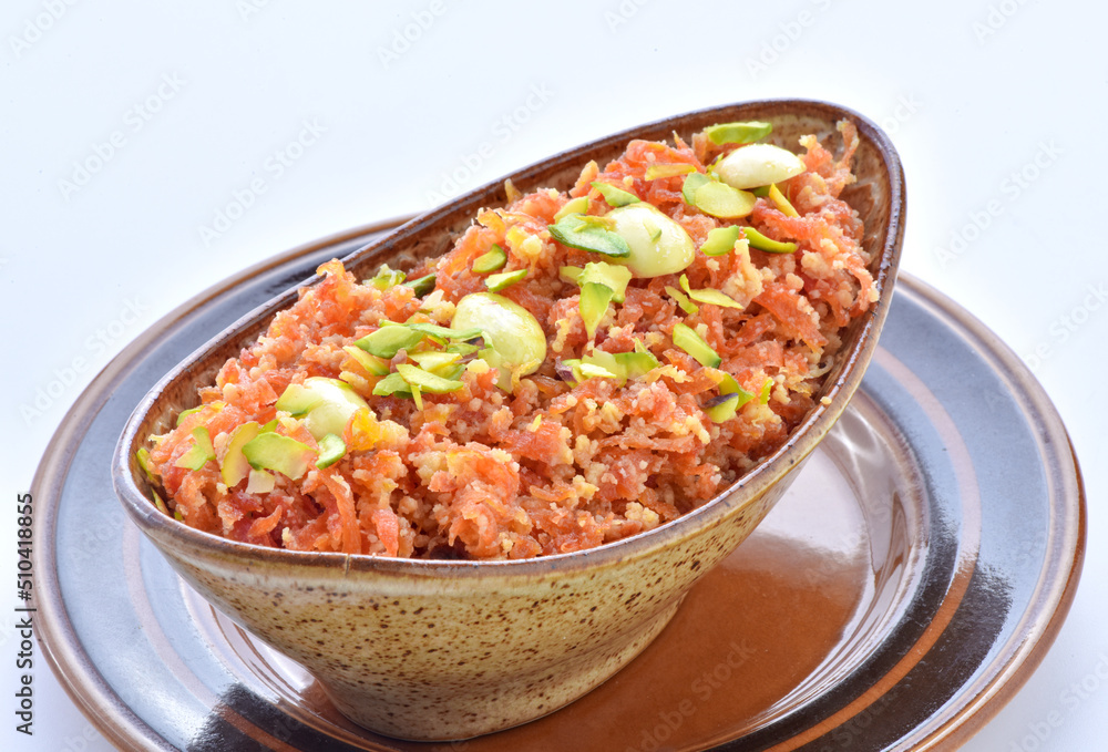Gajar Halwa or Carrot Pudding. A delicious sweet and healthy dessert prepared by pure milk, desi ghee and fresh carrots. Gajar Halwa or Carrot Pudding. A delicious sweet and healthy dessert prepared by pure milk, desi ghee and fresh carrots.
