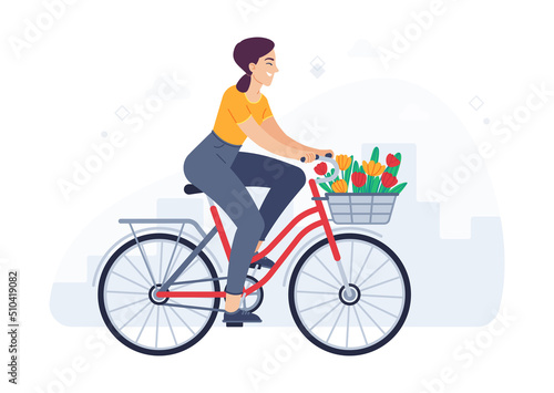 Woman rides bicycle with bouquet in basket. Cheerful girl cyclist moving on bike. Female character enjoying trip