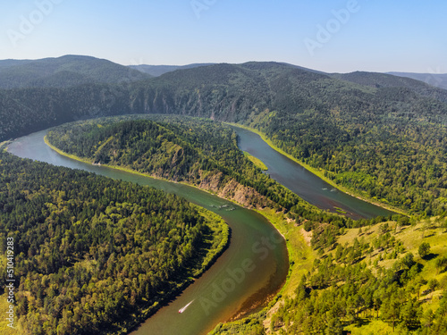 Awesome view of scenic river among evergreen woods