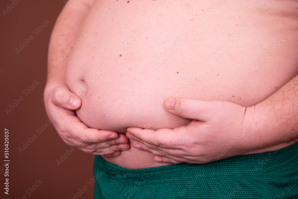 Diet and weight problem. A man with a big belly. Diet and weight problem. A man with a big belly.