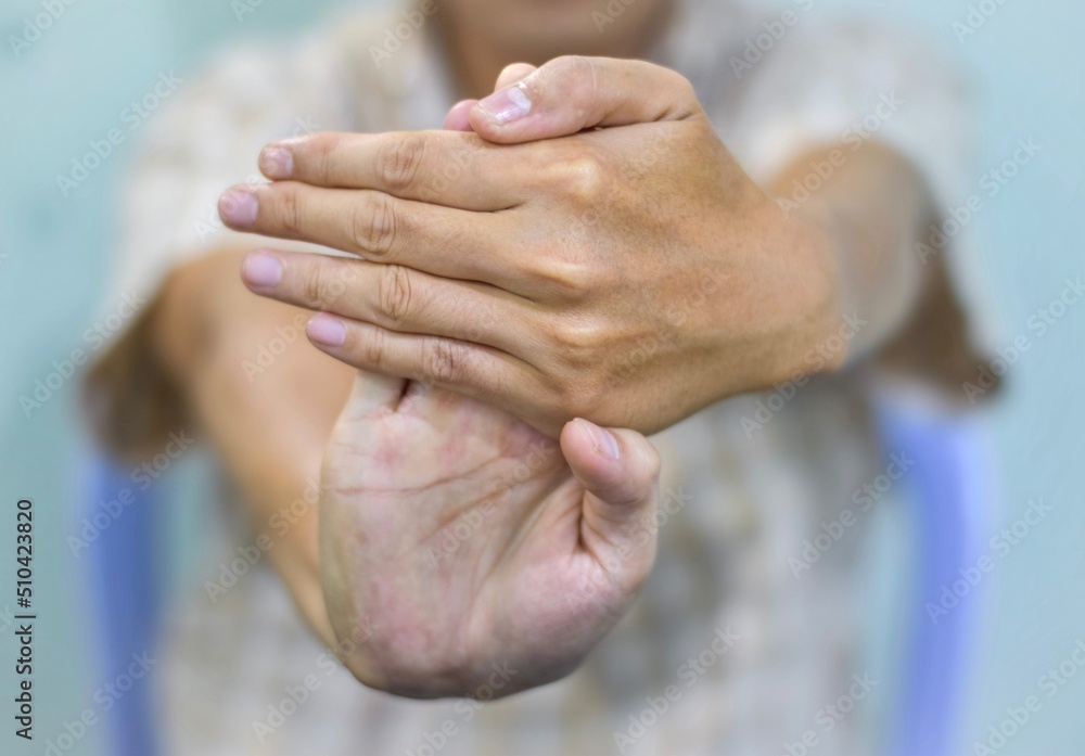 Strengthening exercise for arm muscles of Asian elder patient with muscle spasm. Strengthening exercise for arm muscles of Asian elder patient with muscle spasm.
