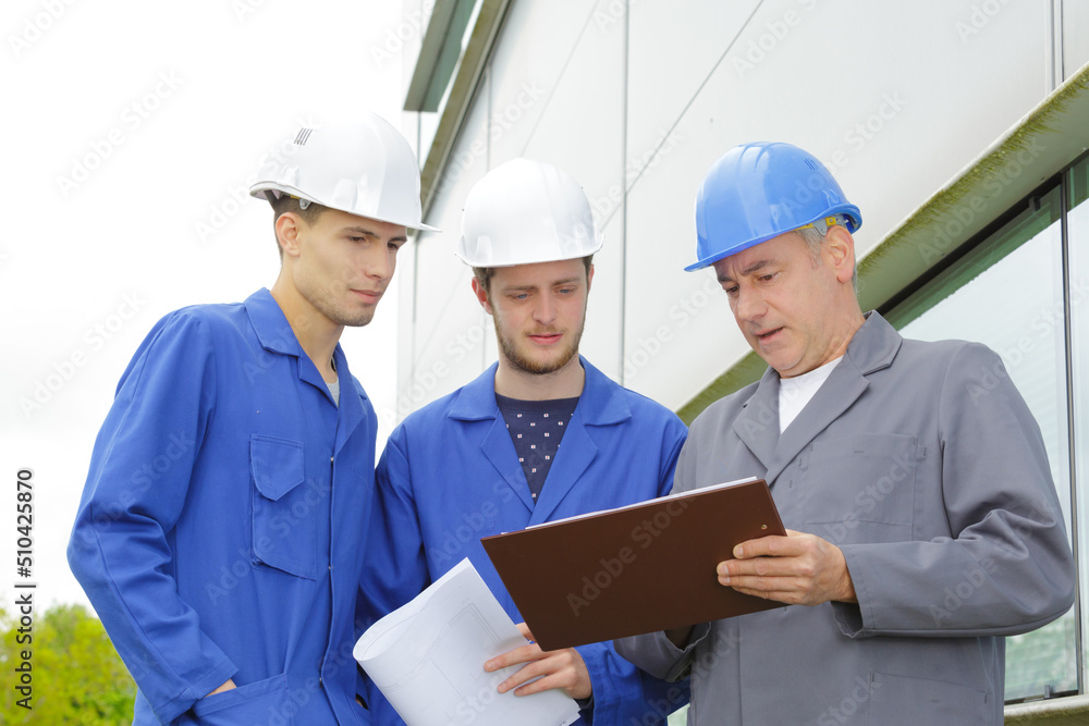 portrait of construction workers outside portrait of construction workers outside