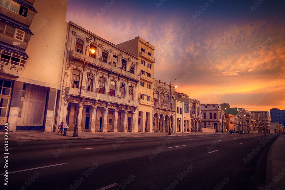 Sunset at Malecon, the famous Havana promenades where Habaneros, lovers and most of all individual fishermen meet, Havana, Cuba - obrazy, fototapety, plakaty 