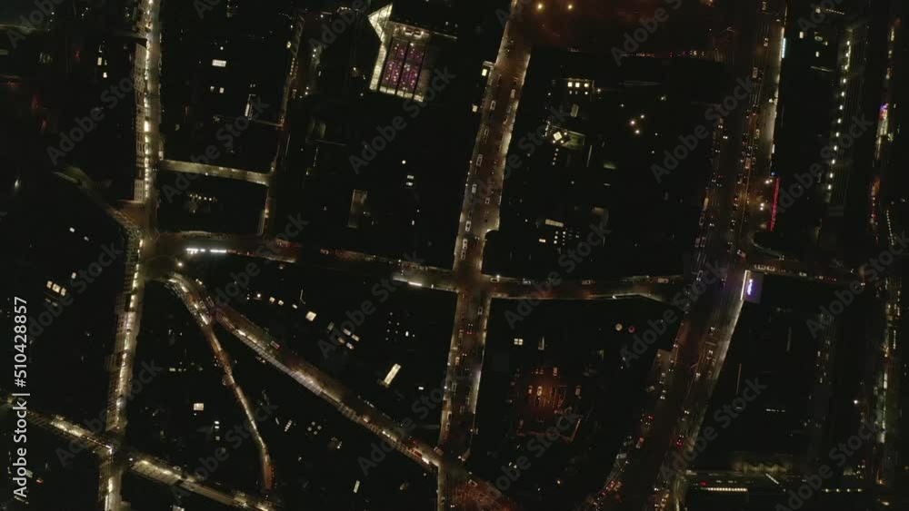 Overhead shot of town development in night city. Traffic on multilane trunk road in evening. Cologne, Germany Overhead shot of town development in night city. Traffic on multilane trunk road in evening. Cologne, Germany