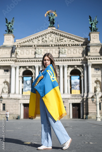 Ukrainian girl with the flag of Ukraine © OLEKSANDRA