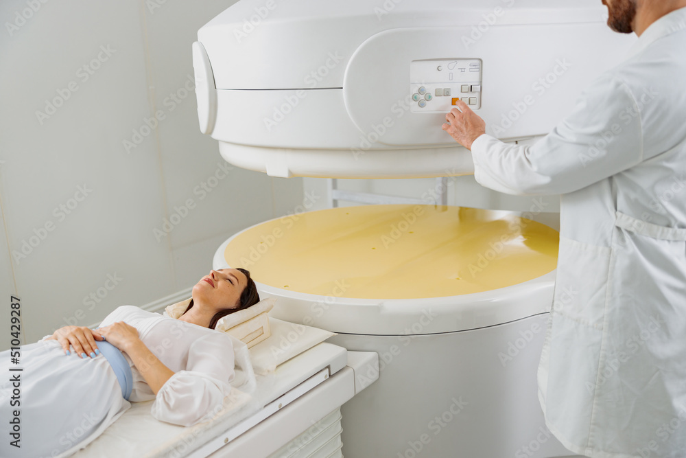 Woman patient is ready to do magnetic resonance imaging MRI or CT scan in clinic Woman patient is ready to do magnetic resonance imaging MRI or CT scan in clinic