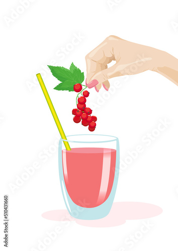 A hand lowers a branch of red currant with a fresh leaf into a glass with a drink and a straw