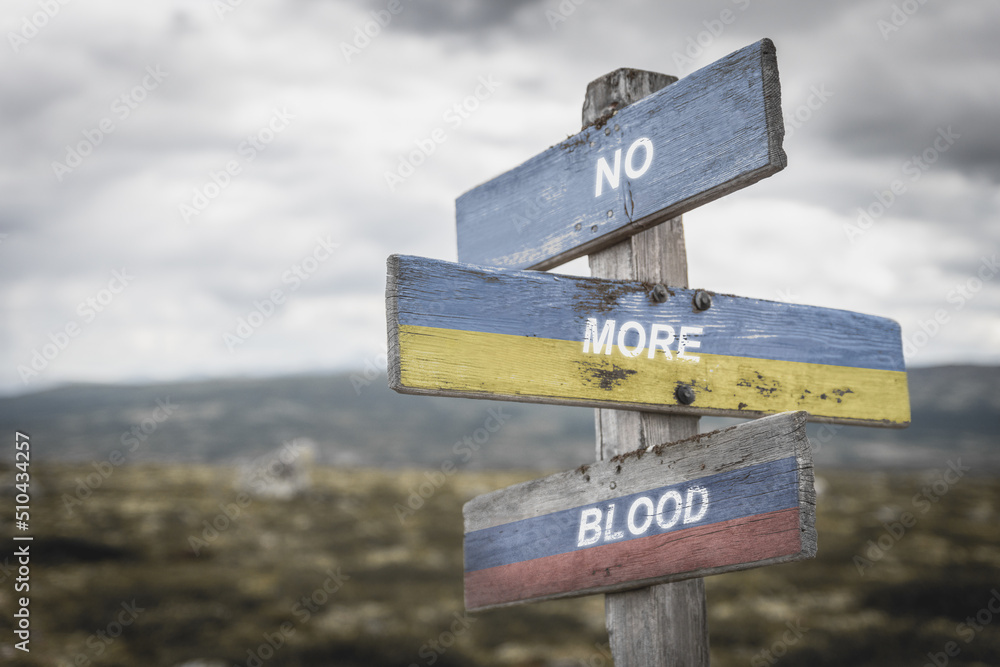 no more blood text on wooden signpost with the ukrainian and russian flags outoors in nature.