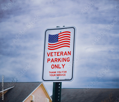 Geneva, Ohio, USA - 4-1-22:  A Veteran Parking Only sign in the parking lot of the Geneva Lodge