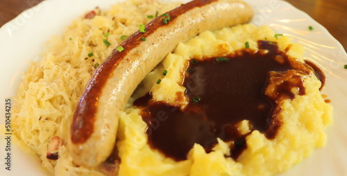 mashed potatoes with sausage and pickled cabbage © maho