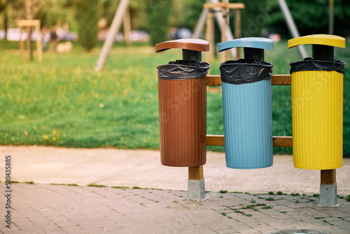 Three bins with different colors to promote the recycling of garbage