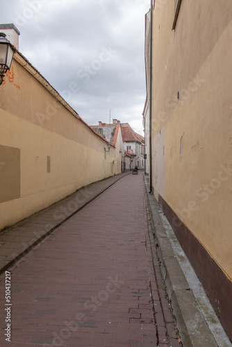 Narrow street of Vilnius city in Lithuania, old town of Vilnius. © Zbignev