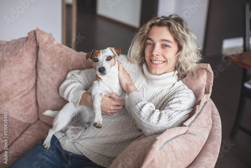 Happy young man at home on the sofa © Tatyana Gladskih