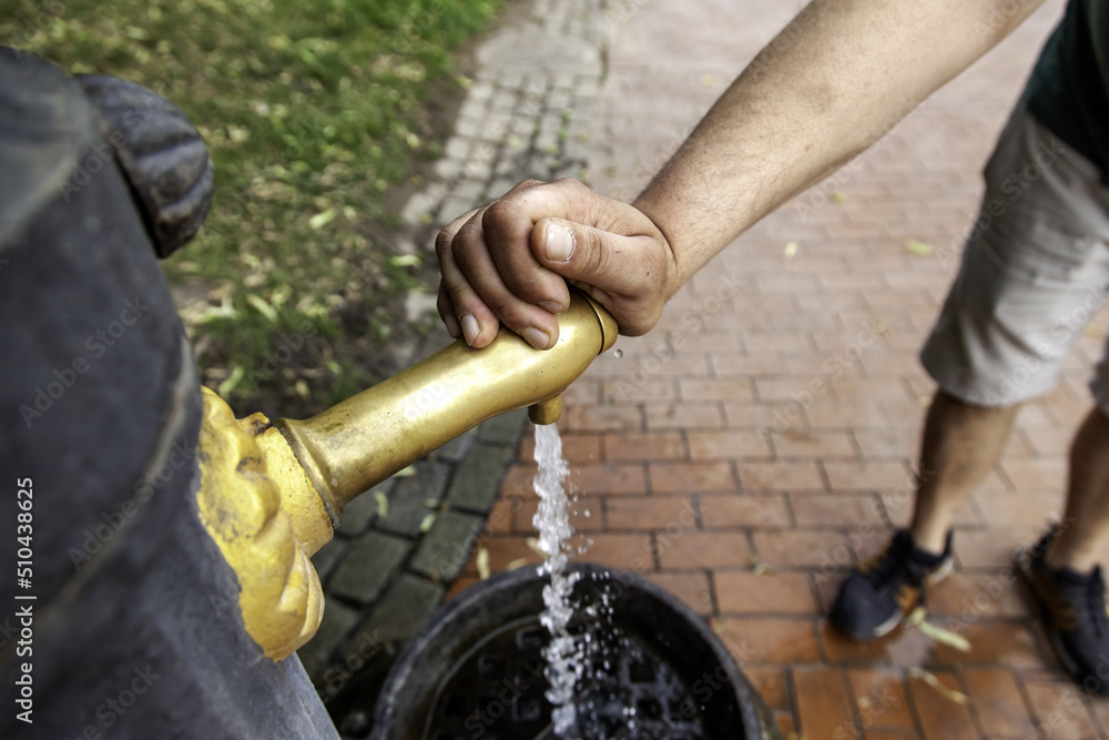 Hand in fountain with water Hand in fountain with water