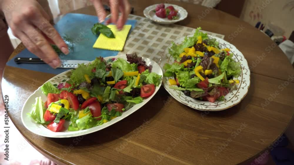 Female hands making healthy vegetable salad at home kitchen. High quality 4k footage Female hands making healthy vegetable salad at home kitchen. High quality 4k footage