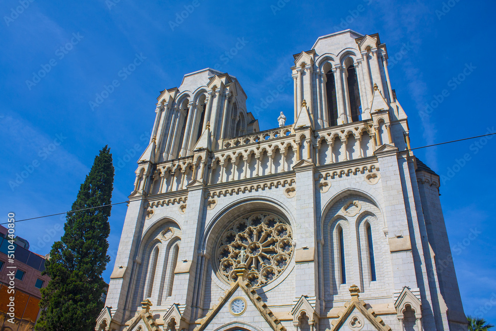 Basilique Notre Dame de Nice is a Roman Catholic Neo-Gothic basilica situated on the Avenue Jean-Medecin in the centre of Nice, France	 - obrazy, fototapety, plakaty 