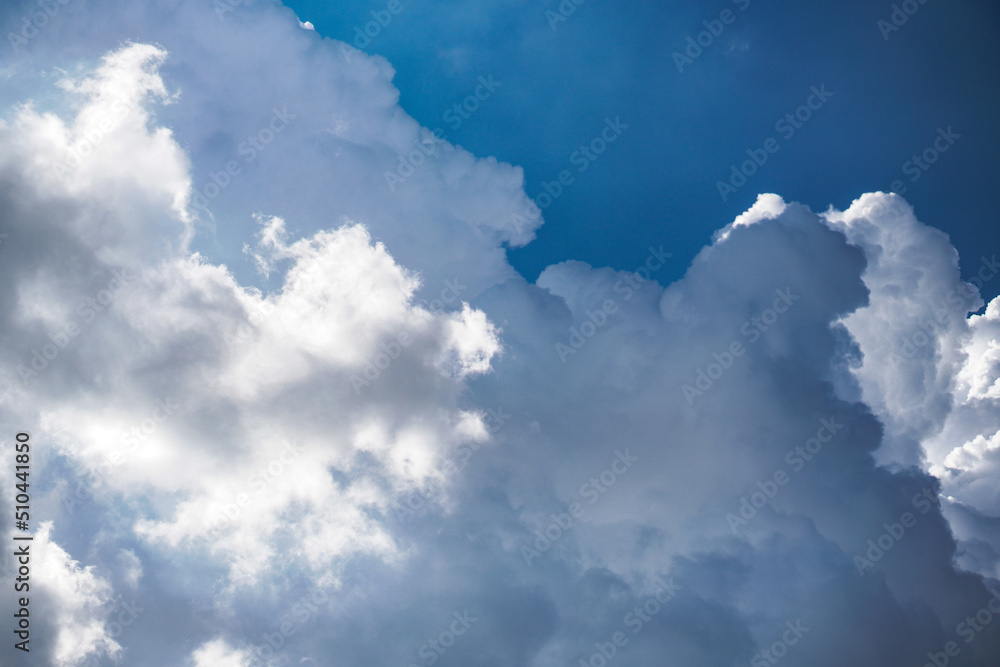 Clouds on the blue sky in sunlight. Great view from the plane. Clouds on the blue sky in sunlight. Great view from the plane.