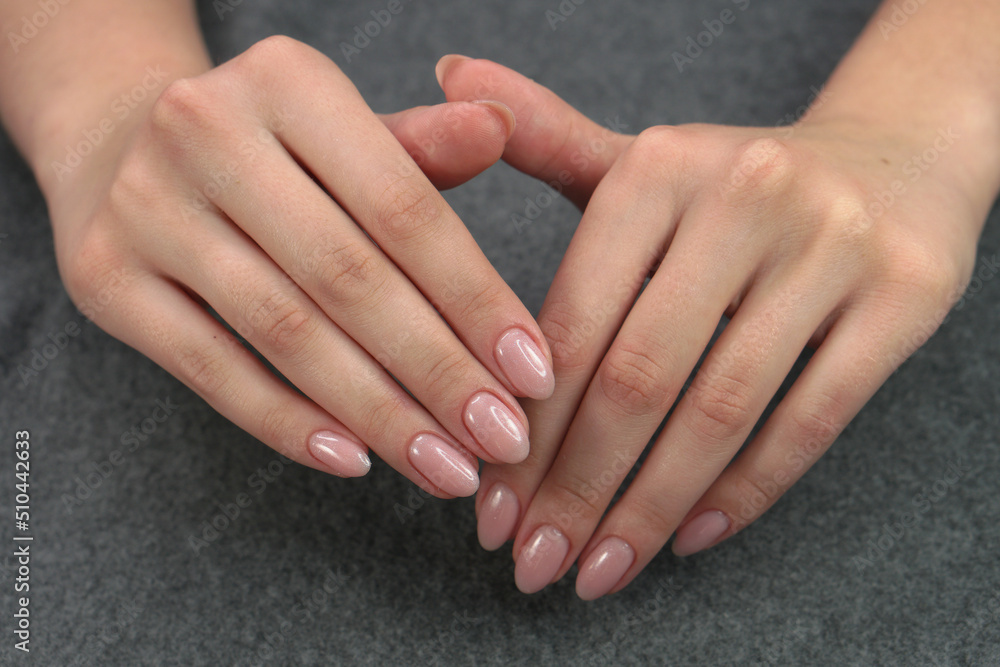 Women's hands after manicure and gel polish. Cosmetology procedure and skin care in a beauty salon. Women's hands after manicure and gel polish. Cosmetology procedure and skin care in a beauty salon.