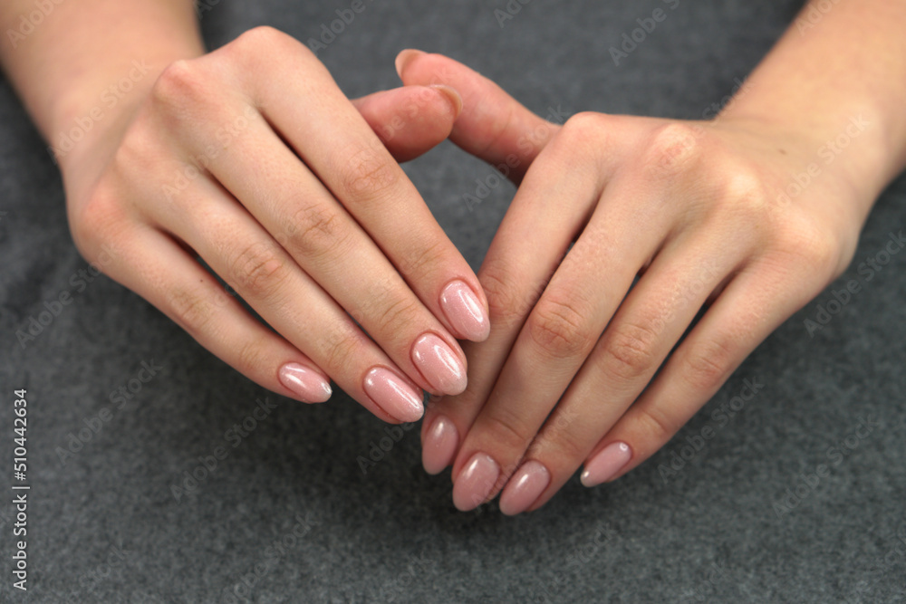 Women's hands after manicure and gel polish. Cosmetology procedure and skin care in a beauty salon. Women's hands after manicure and gel polish. Cosmetology procedure and skin care in a beauty salon.