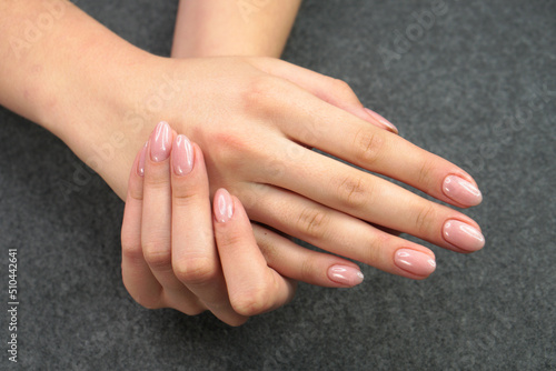 Women s hands after manicure and gel polish. Cosmetology procedure and skin care in a beauty salon.