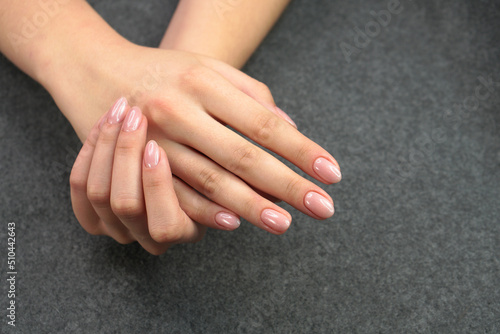 Women's hands after manicure and gel polish. Cosmetology procedure and skin care in a beauty salon.
