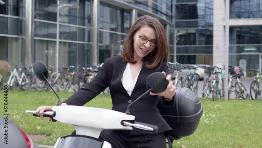 Trendy formal woman in suit sitting on motorbike Trendy formal woman in suit sitting on motorbike