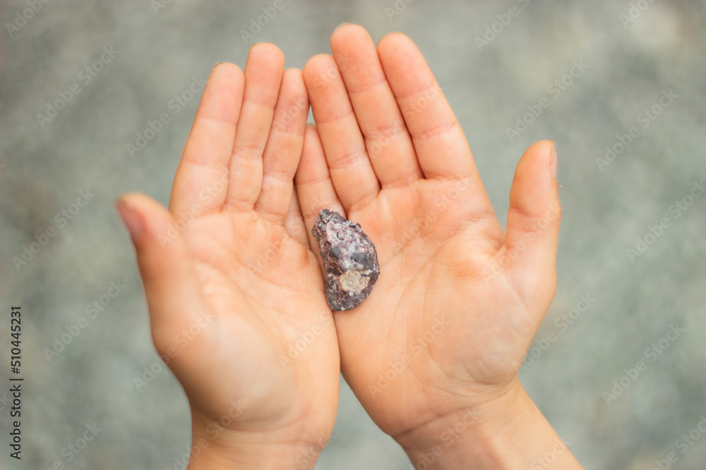 stones rubble in children's palms