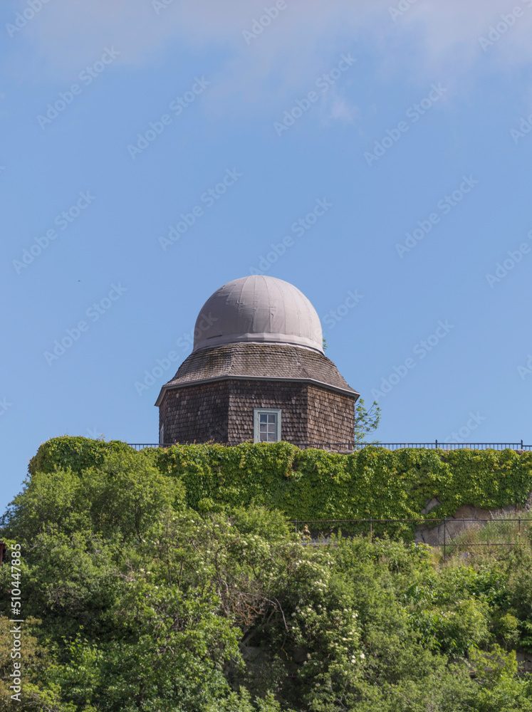 Old small wooden star observatory from early 1900s in a park a sunny day in Stockholm Old small wooden star observatory from early 1900s in a park a sunny day in Stockholm