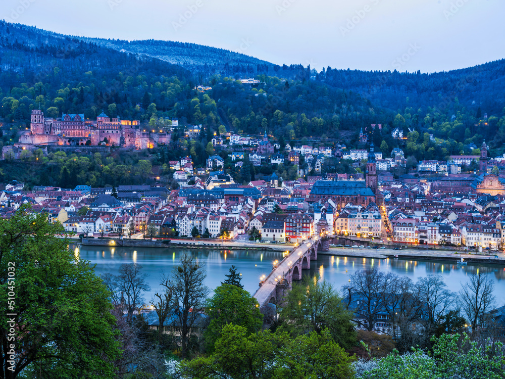 Long exposure shot of Heidelberg old town and Palace illuminated after sunset in Germany