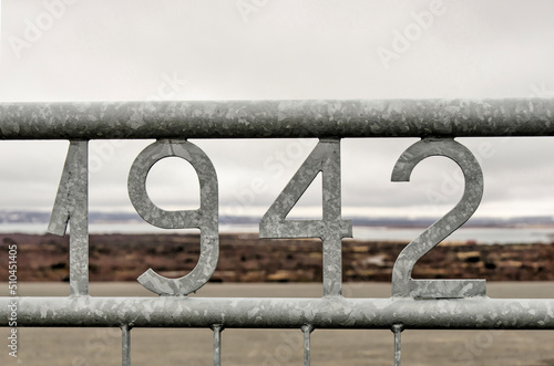 Reykjahlíð, Iceland, April 27, 2022: steel fence with the year 1942 at the entrance of the Dimmuborgir lavafield photo