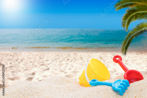 Wallpaper Mural beach landscape background with palm tree, sea and toys or summer objects Torontodigital.ca