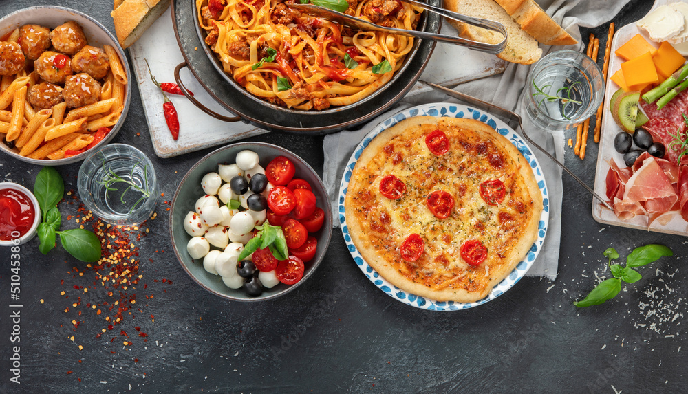 Italian food assortment on dark background. Italian food assortment on dark background.