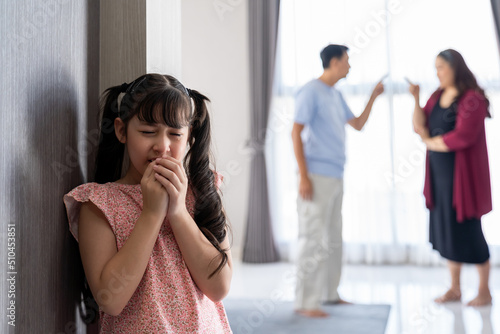 Sad child girl crying with wet eyes from tears from father and mother arguing then feels depressed and lonely. Little girl crying about parents arguing. family negative, quarrels concept.