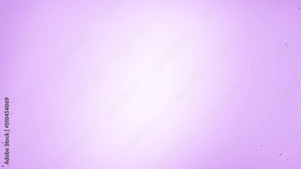 Text face printed on the wet glass blown off with air stream on violet background | face care concept Text face printed on the wet glass blown off with air stream on violet background | face care concept