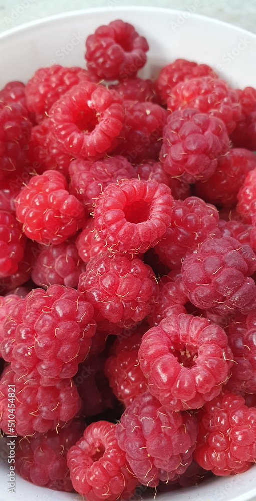 Fresh and sweet raspberries background. Raspberry harvest. Close-up. Fresh and sweet raspberries background. Raspberry harvest. Close-up.