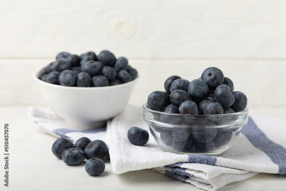 Blueberries in a ceramic bowl on a light textured background. Ripe and fresh blueberries. Vitamins. Healthy food. Juicy berry.Copy space.Place for text Blueberries in a ceramic bowl on a light textured background. Ripe and fresh blueberries. Vitamins. Healthy food. Juicy berry.Copy space.Place for text