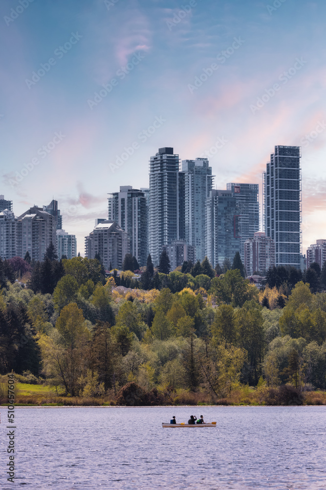 Obraz premium View of Residential Apartment Home Buildings in Metrotown. Green Trees in Deer Lake Park, Burnaby, Vancouver, BC, Canada. Sunset Sky Art Render